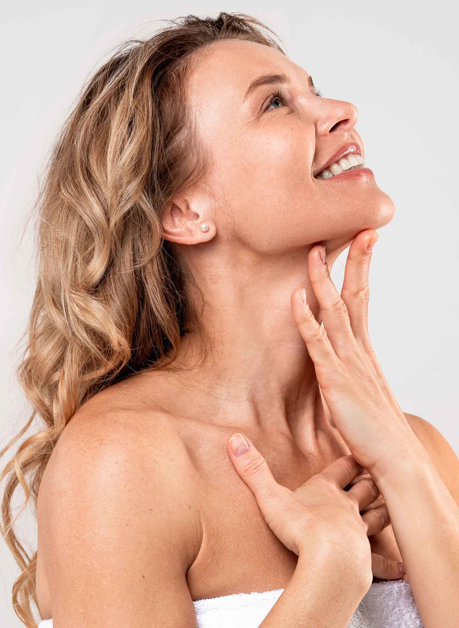 Profile of a happy woman touching her chin